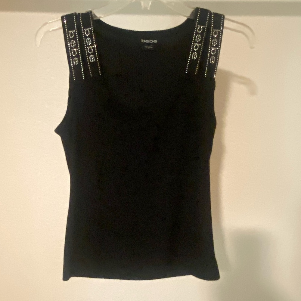 Bebe double strapped, bejeweled sleeveless black ribbed shirt.
